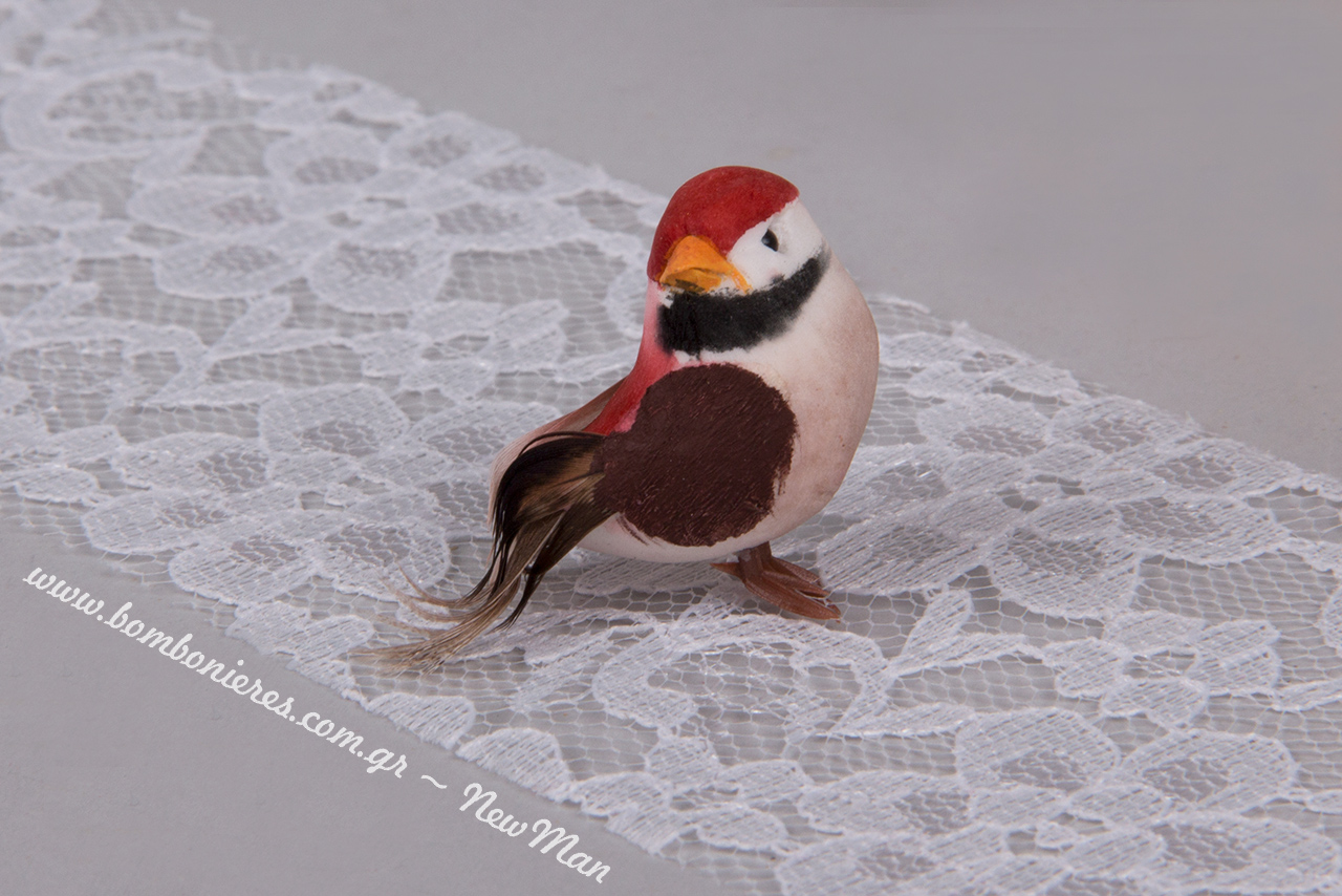 Διακοσμητικό πουλάκι σε κόκκινο χρώμα (3x2cm). Διατίθεται σε συσκευασία των 24 τεμαχίων.